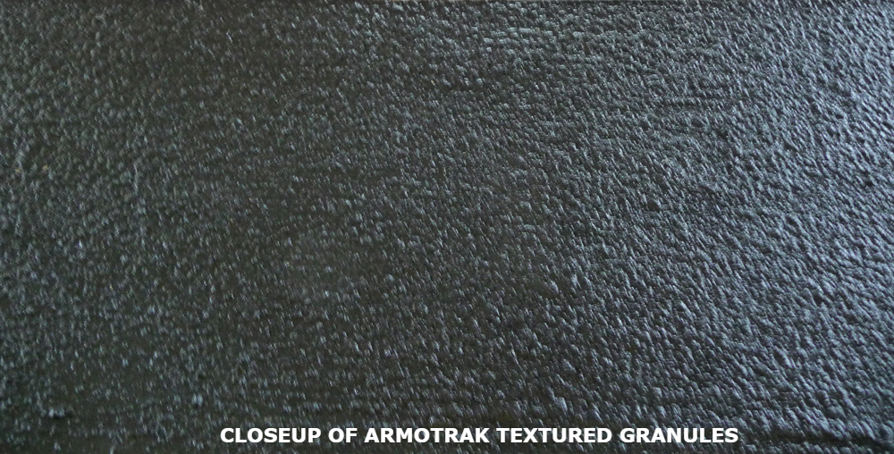ArmorTrak rubber granule closeup — granules chemically bond into the epoxy during cure